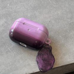 The Earphone Case Is Tinted With Purple Ink