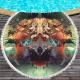 Round beach towel with colorful feathers and tassels